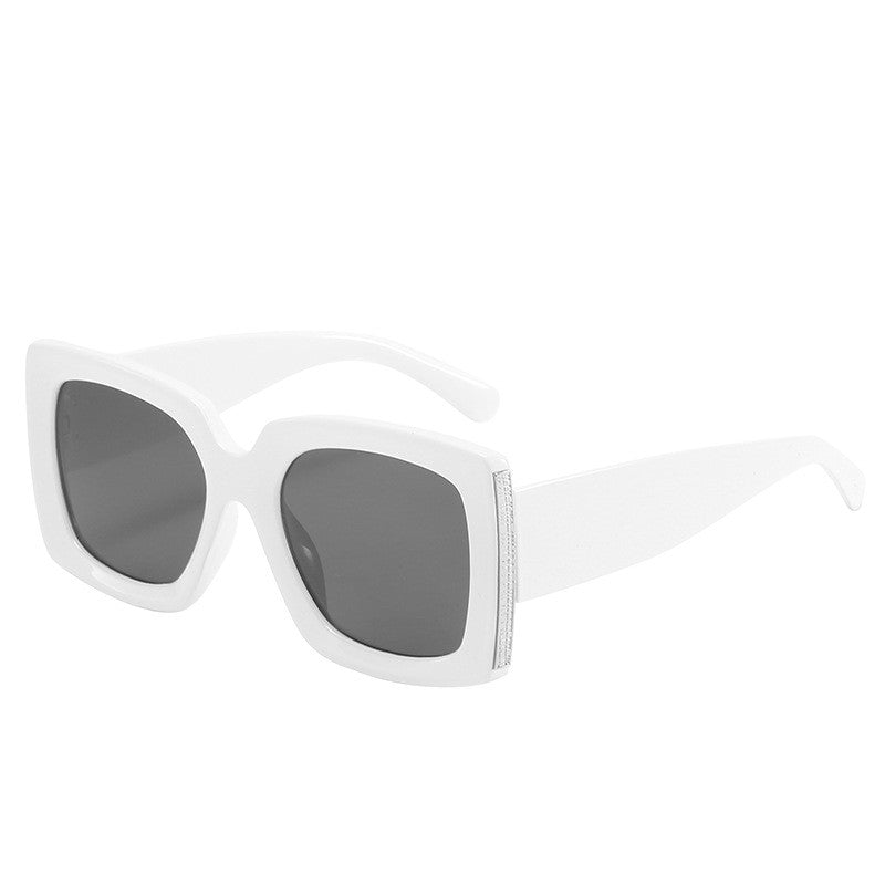 A pair of Beachy Cover Ups trendy large frame sunglasses on a white background.