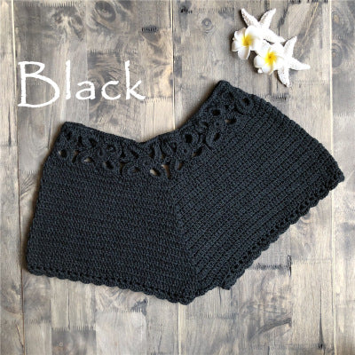 A Beachy Cover Ups black crocheted shorts with flowers on it, featuring color variation.
