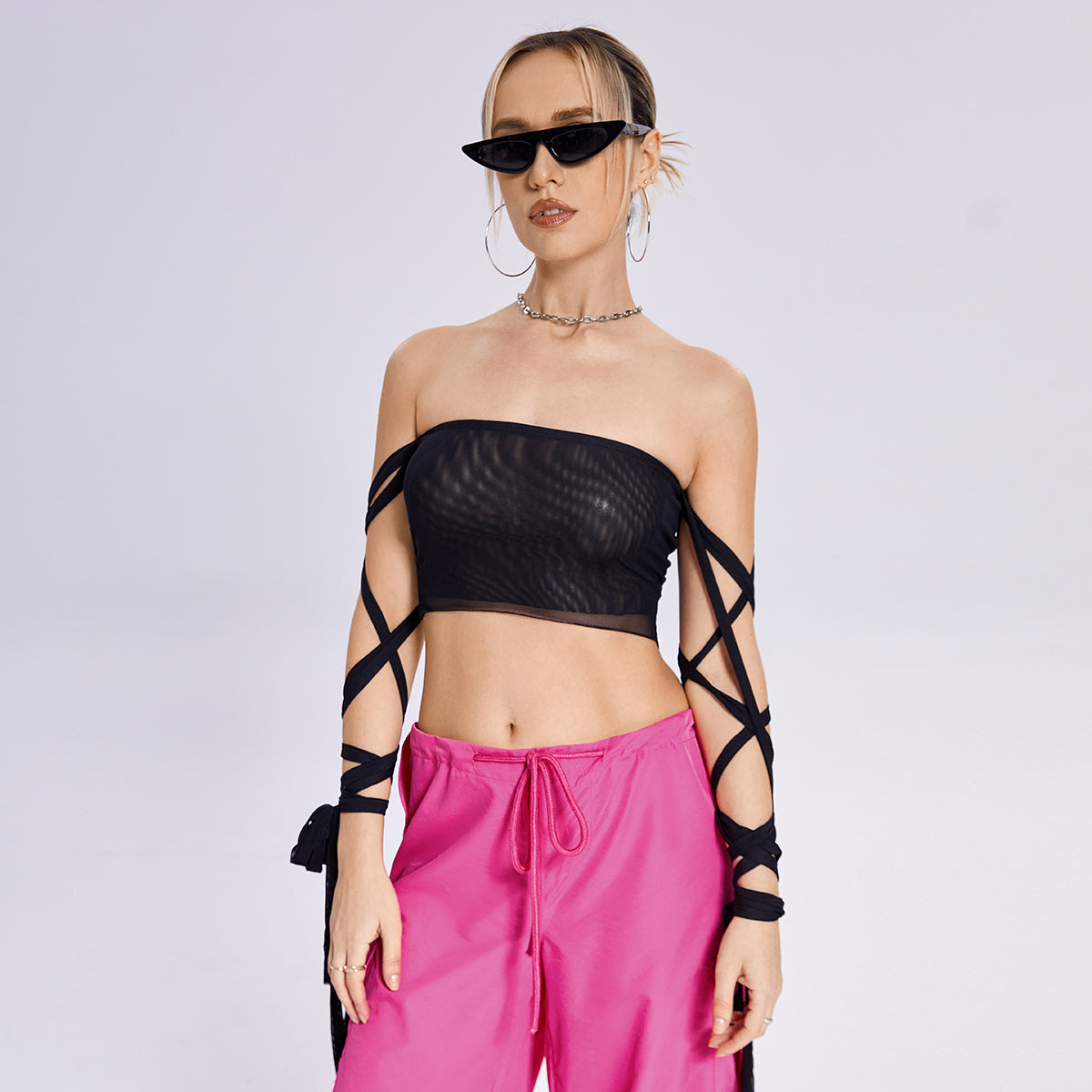 The model is wearing a Beachy Cover Ups Arm Ribbon Straps Black Top.