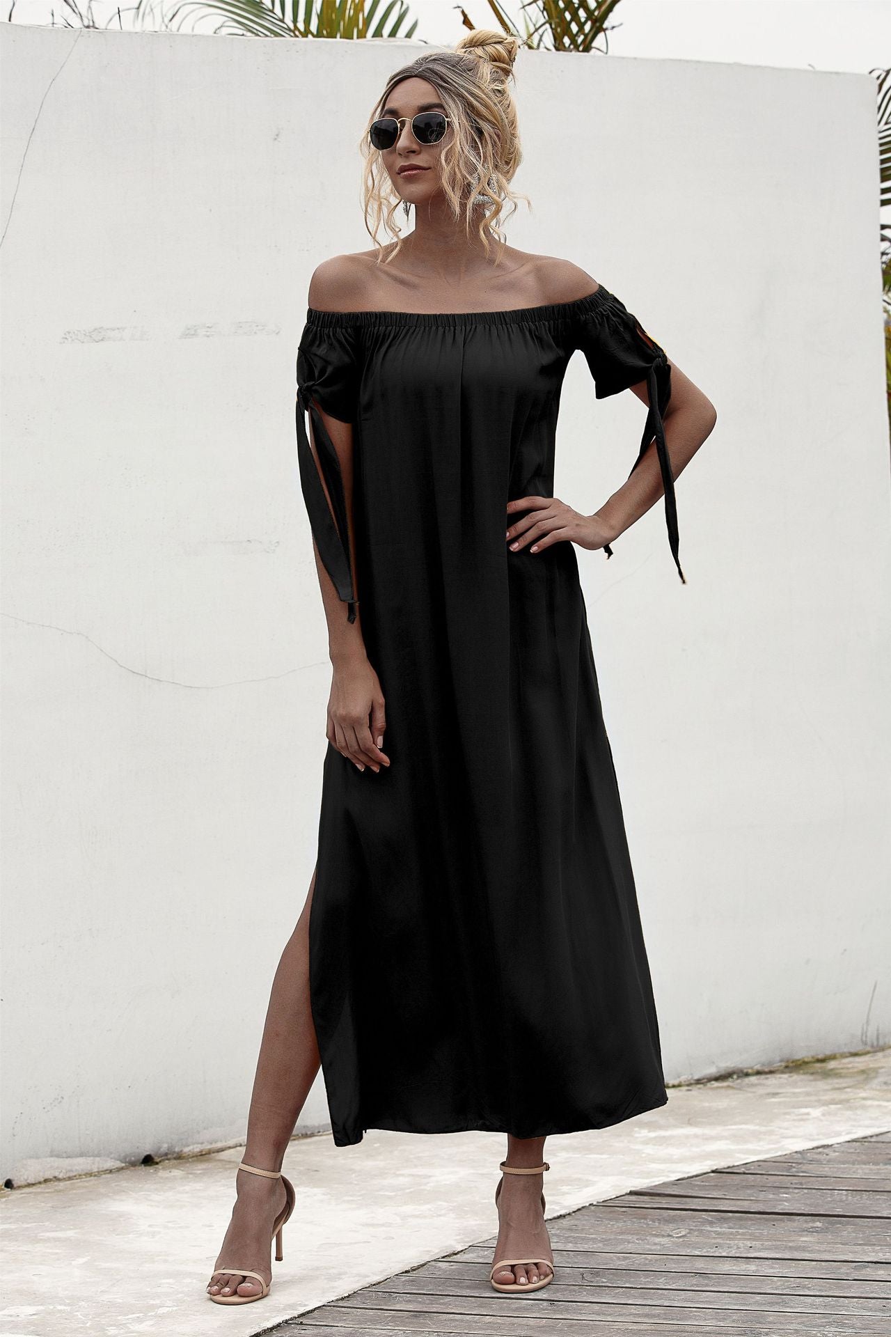 A woman wearing a Beachy Cover Ups' Summer Straight Shoulder Split Beach Dress.