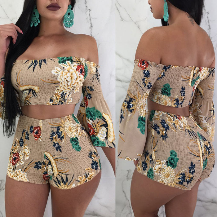 A woman in a Floral Stretch Fabric Two-piece Beach Set by Beachy Cover Ups featuring high-waisted bottoms.