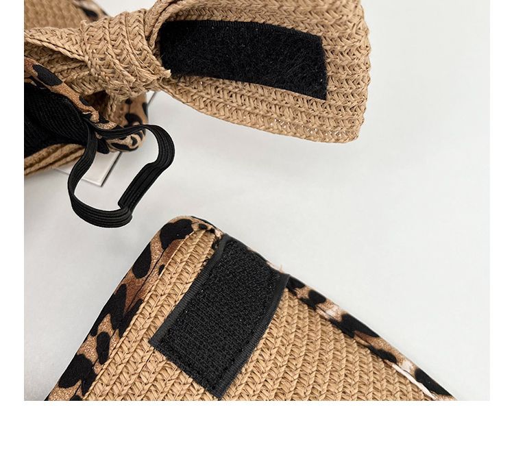 A pair of Big Brim Cheetah Print Edge Straw Visor sandals with a bow on them.