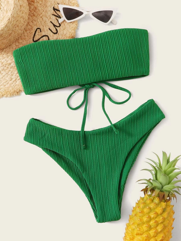 A Beachy Cover Ups beachy bandeau bikini with a solid striped texture and green pineapple print.