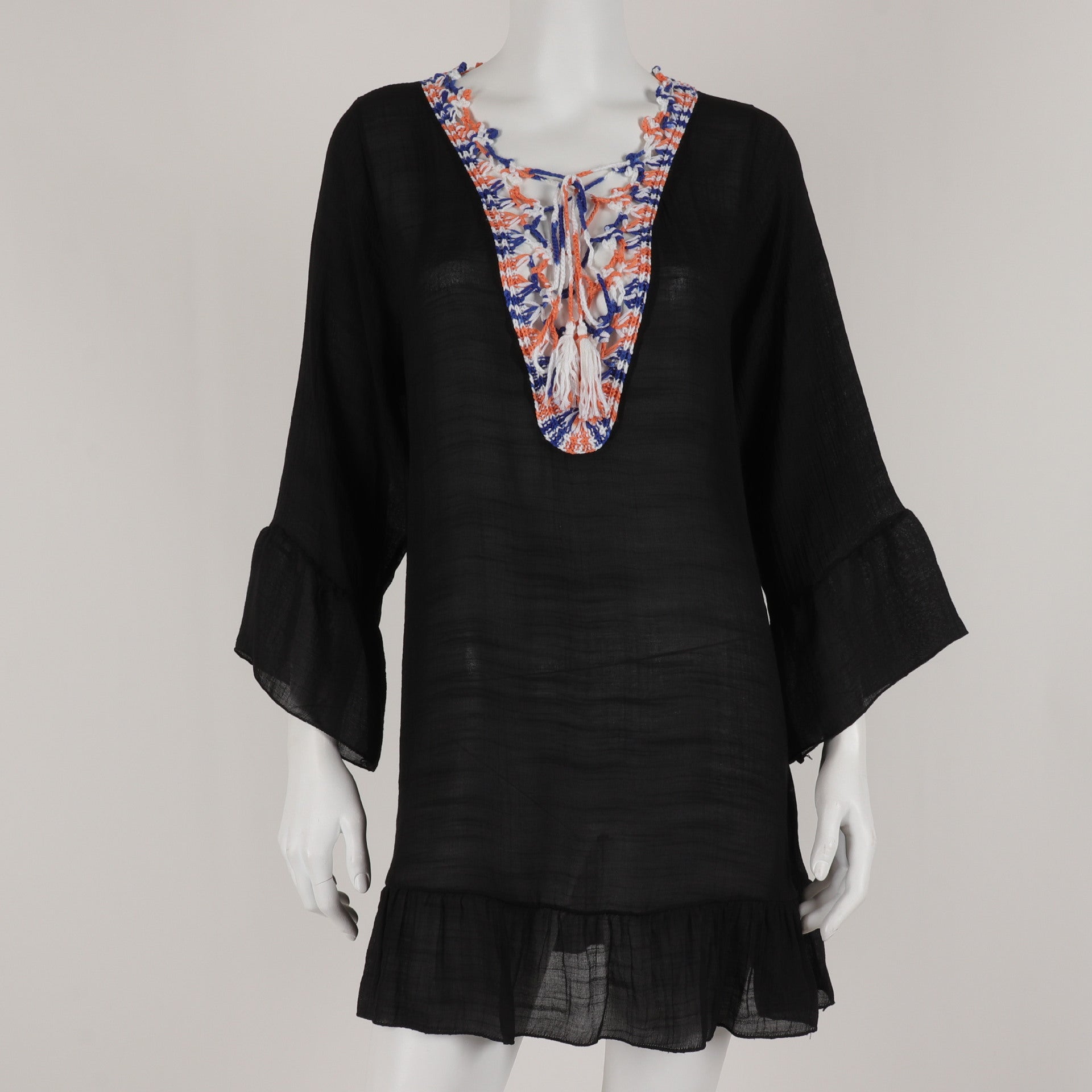 A mannequin wearing a Pretty Open Neck Beach Top by Beachy Cover Ups, with colorful embroidery, giving off beach vibes.